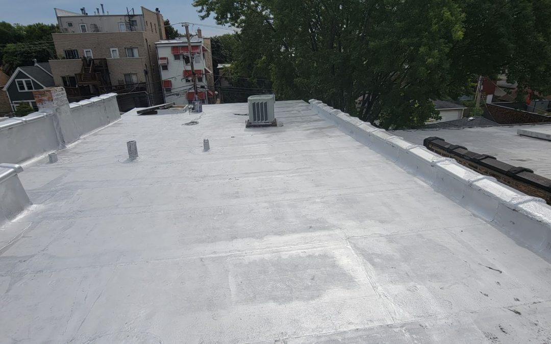 Close up of silver coating on flat roof install in Chicago